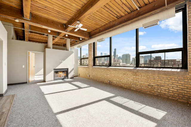 Timber loft with fireplace and tons of windows in River West Chicago
