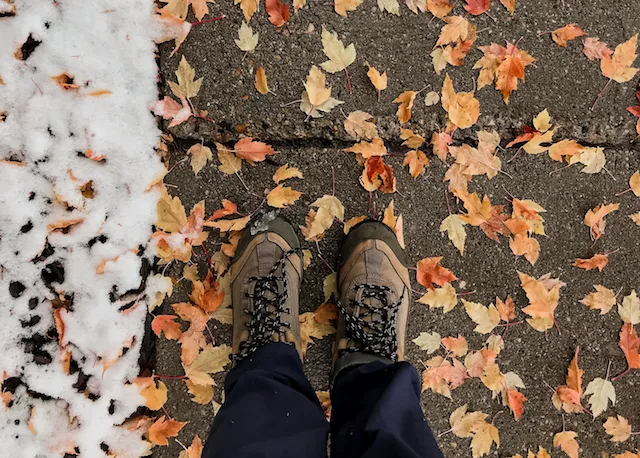 boots_on_sidewalk_leaves_snow_on_ground
