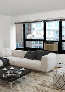 sectional sofa and windows in living room of 1 bedroom apartment for rent in Chicago