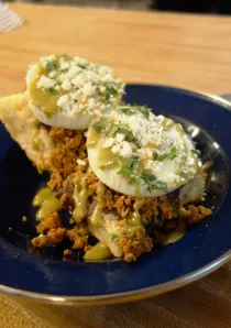 a plate with huevos and biscuits in a Chicago restaurant