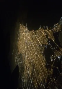 an aerial shot taken above Chicago at night showing the city traffic grid system