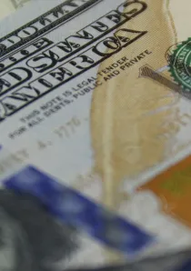 a close up picture of hundred dollar bills