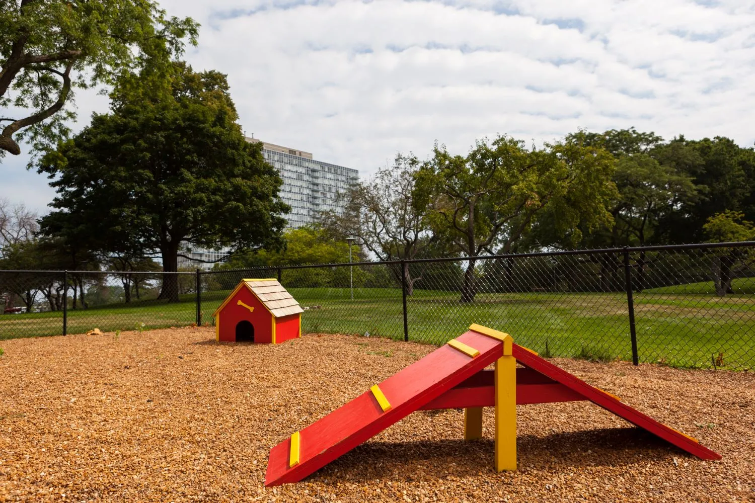 trees in front of the glass Lake Meadows Apartments in Bronzeville Chicago