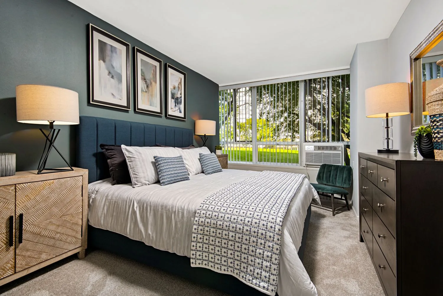 trees in front of the glass Lake Meadows Apartments in Bronzeville Chicago