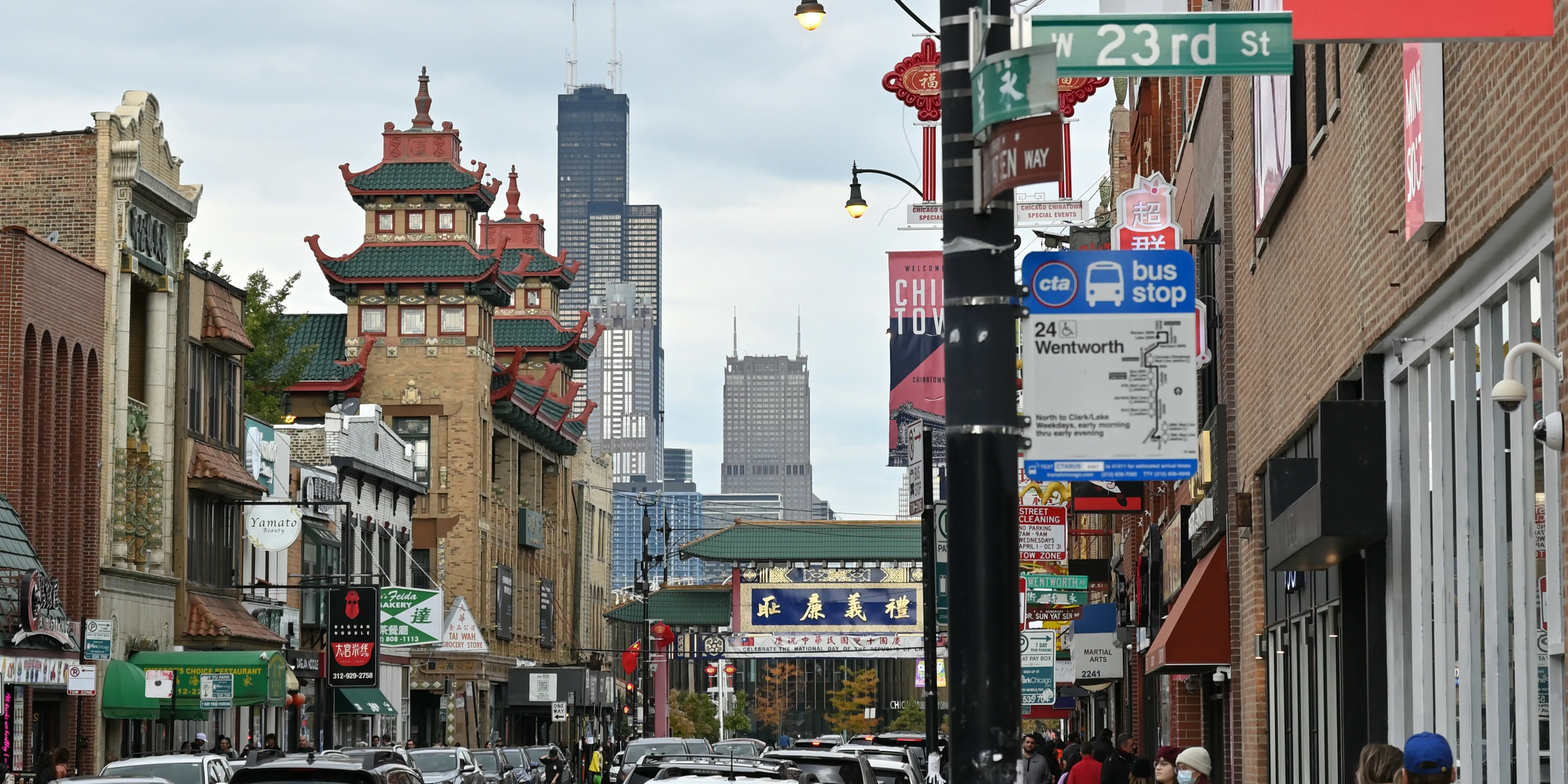 Looking north on Wentworth towards Cermak in the middle of Chinatown in Chicago with the Willis Tower in the distance.