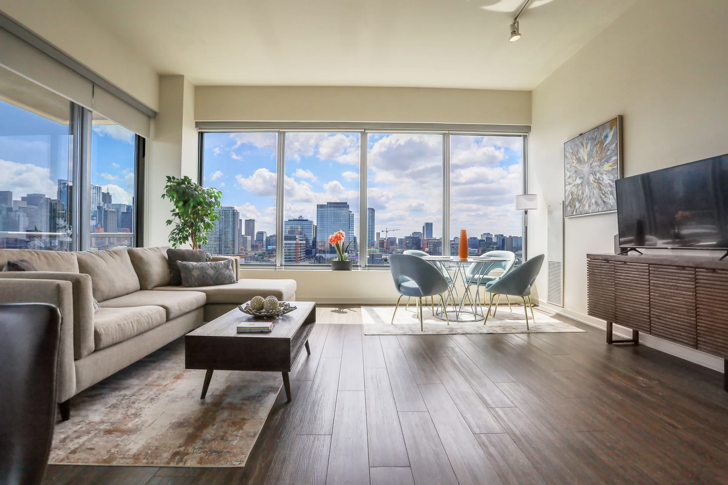 living room and view of chicago at Mondial River West Apartments