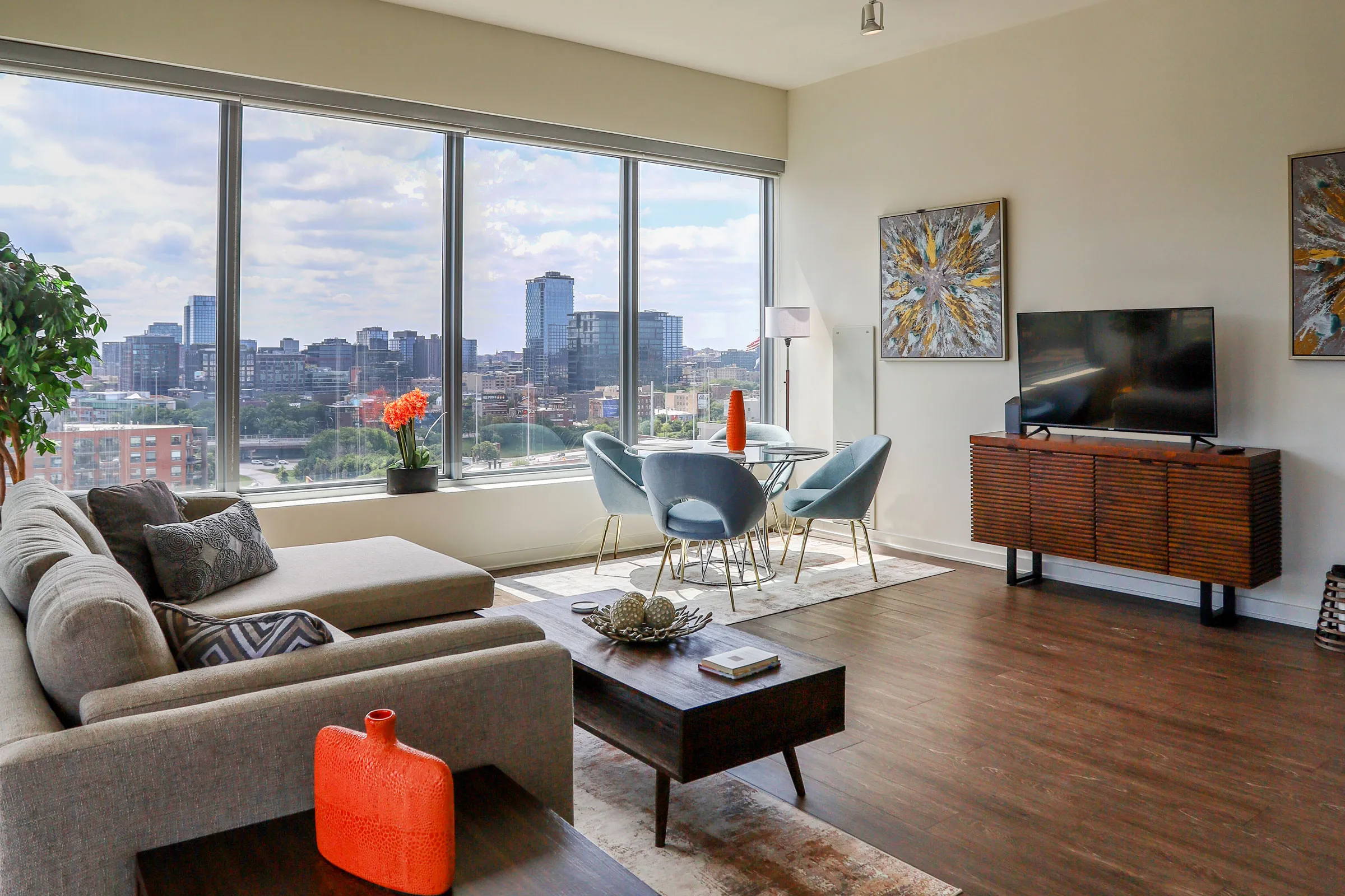 living room and view of chicago at Mondial River West Apartments