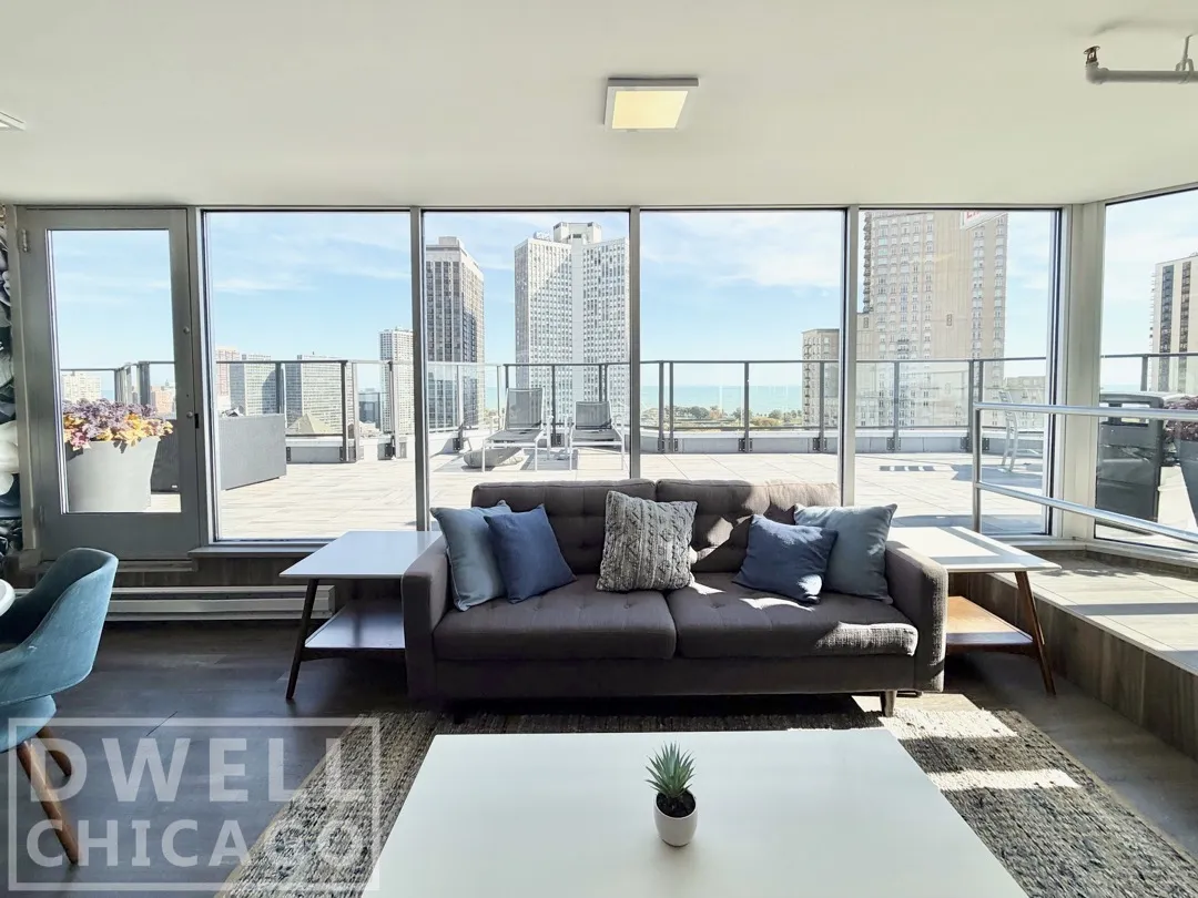 lounge chairs and view on roof at 2555 N. Clark Apartments in Lincoln Park