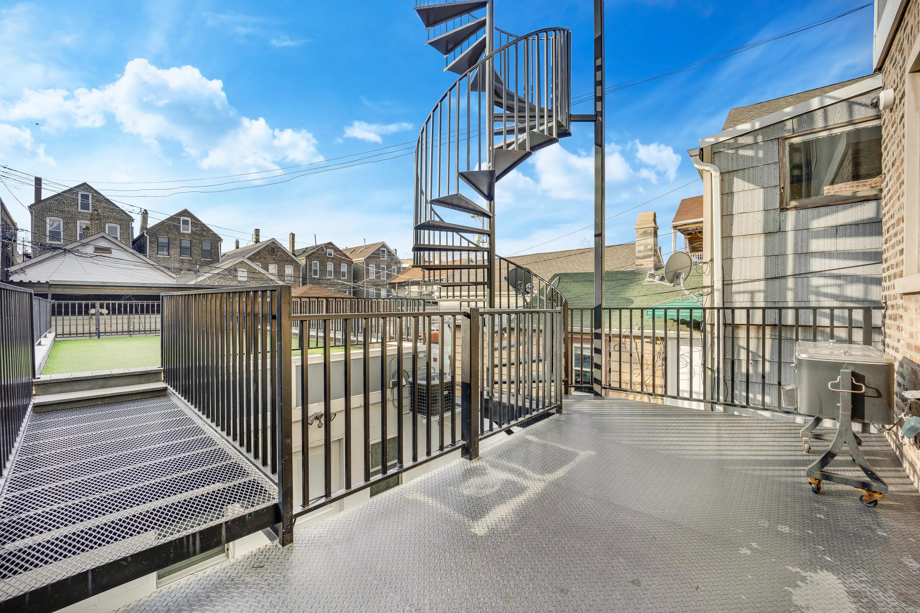 spiral stairs at 1317 W 18th Place Apartments in Pilsen, Chicago