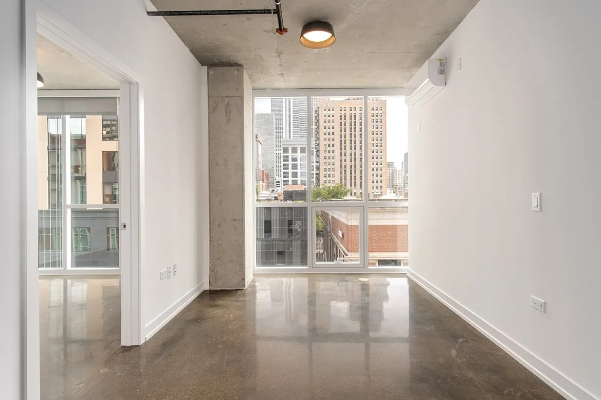 Living room at Bush Temple in River North with a sofa and hanging light