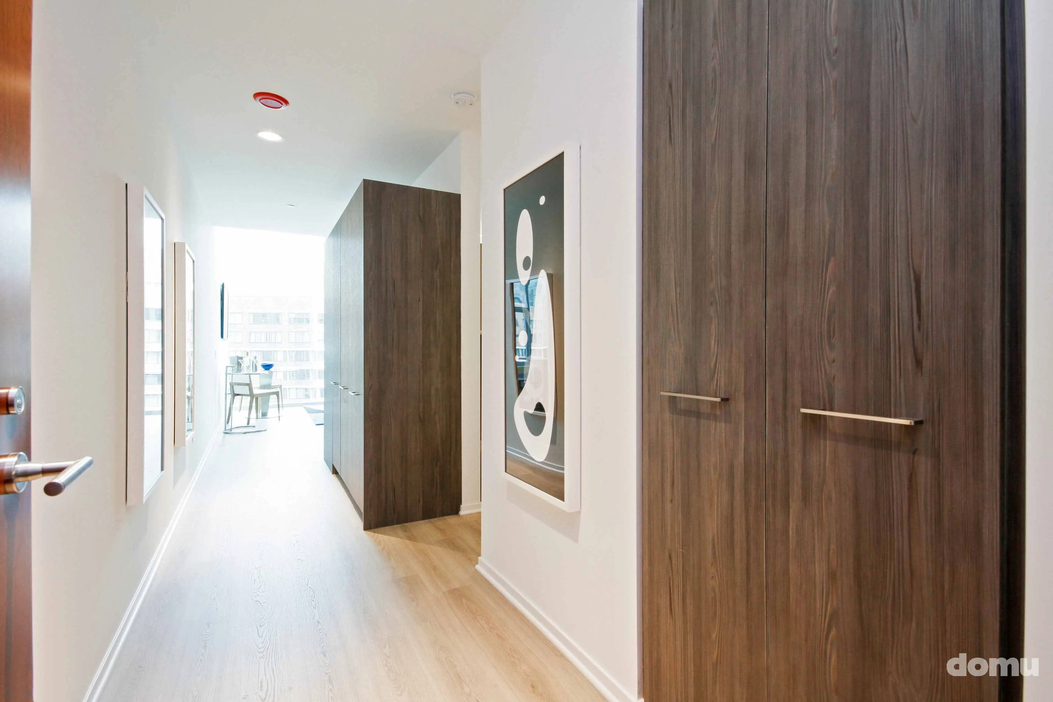 model kitchen with view of Chicago at Optima Signature Apartments