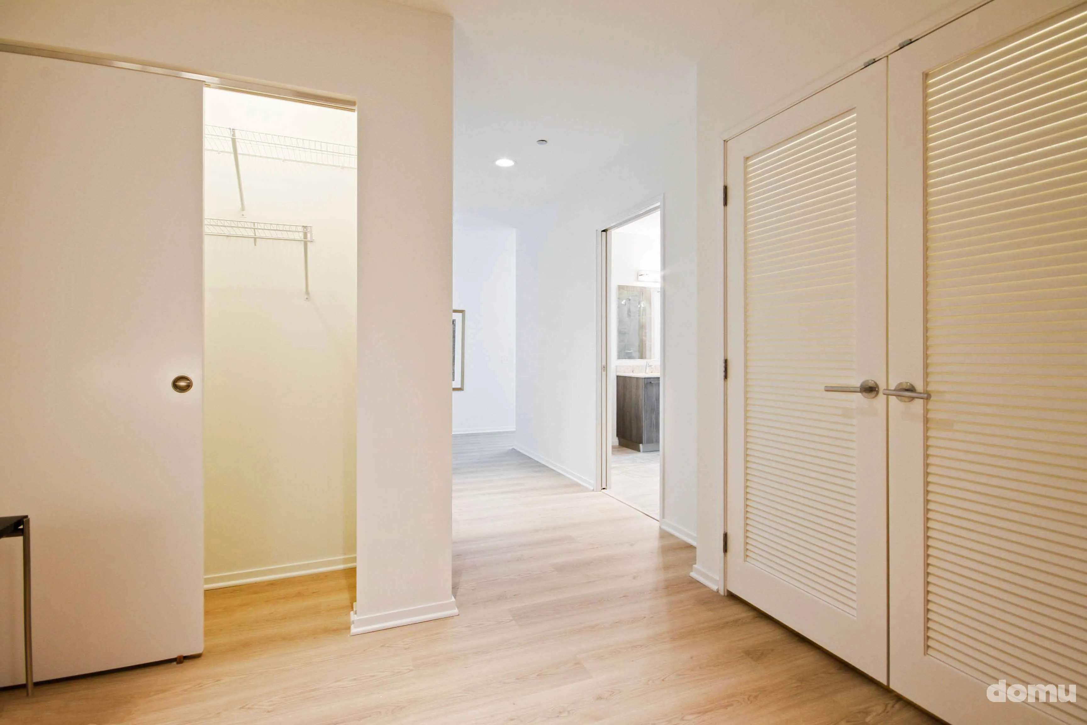 model kitchen with view of Chicago at Optima Signature Apartments