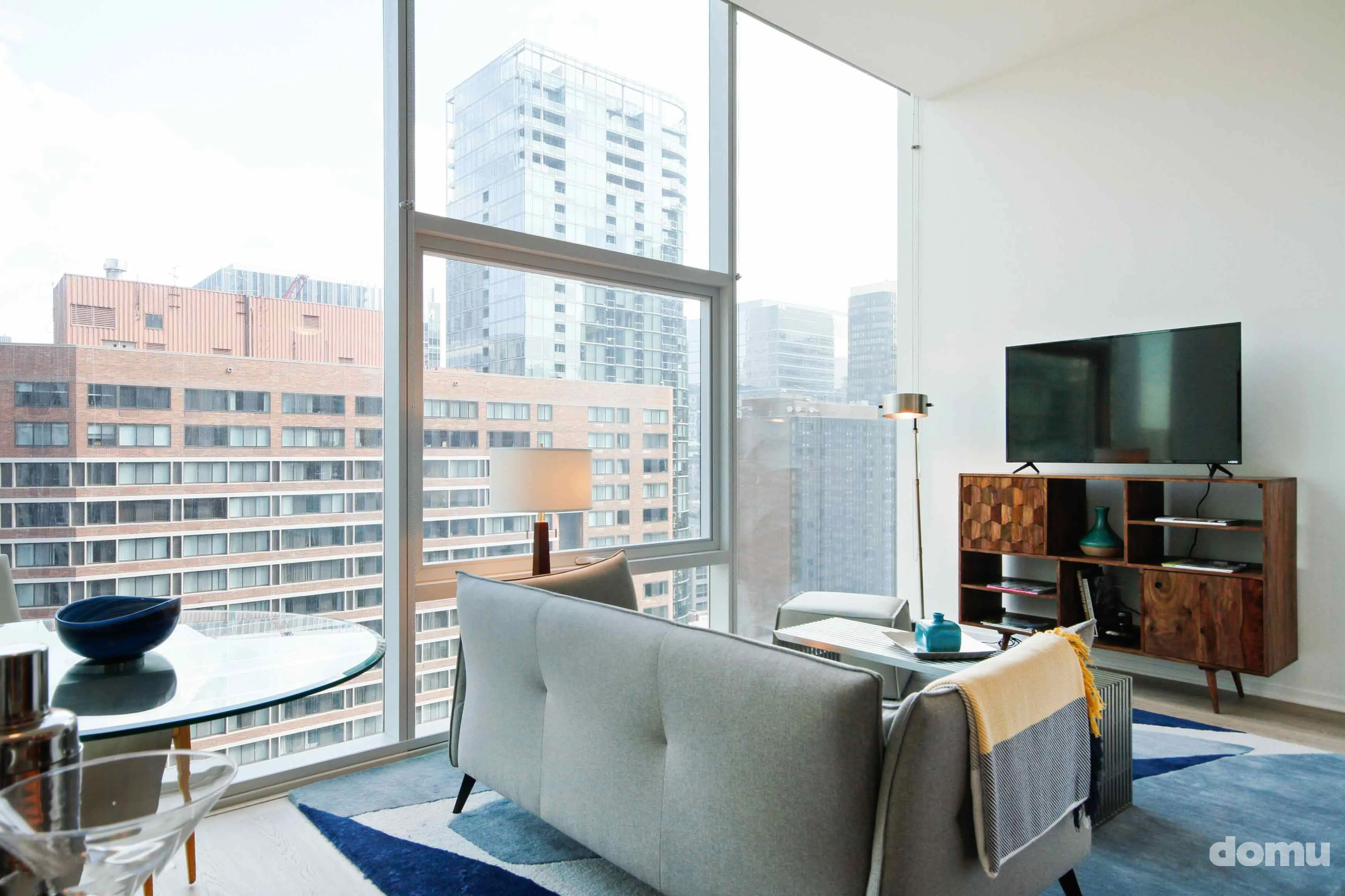 model kitchen with view of Chicago at Optima Signature Apartments