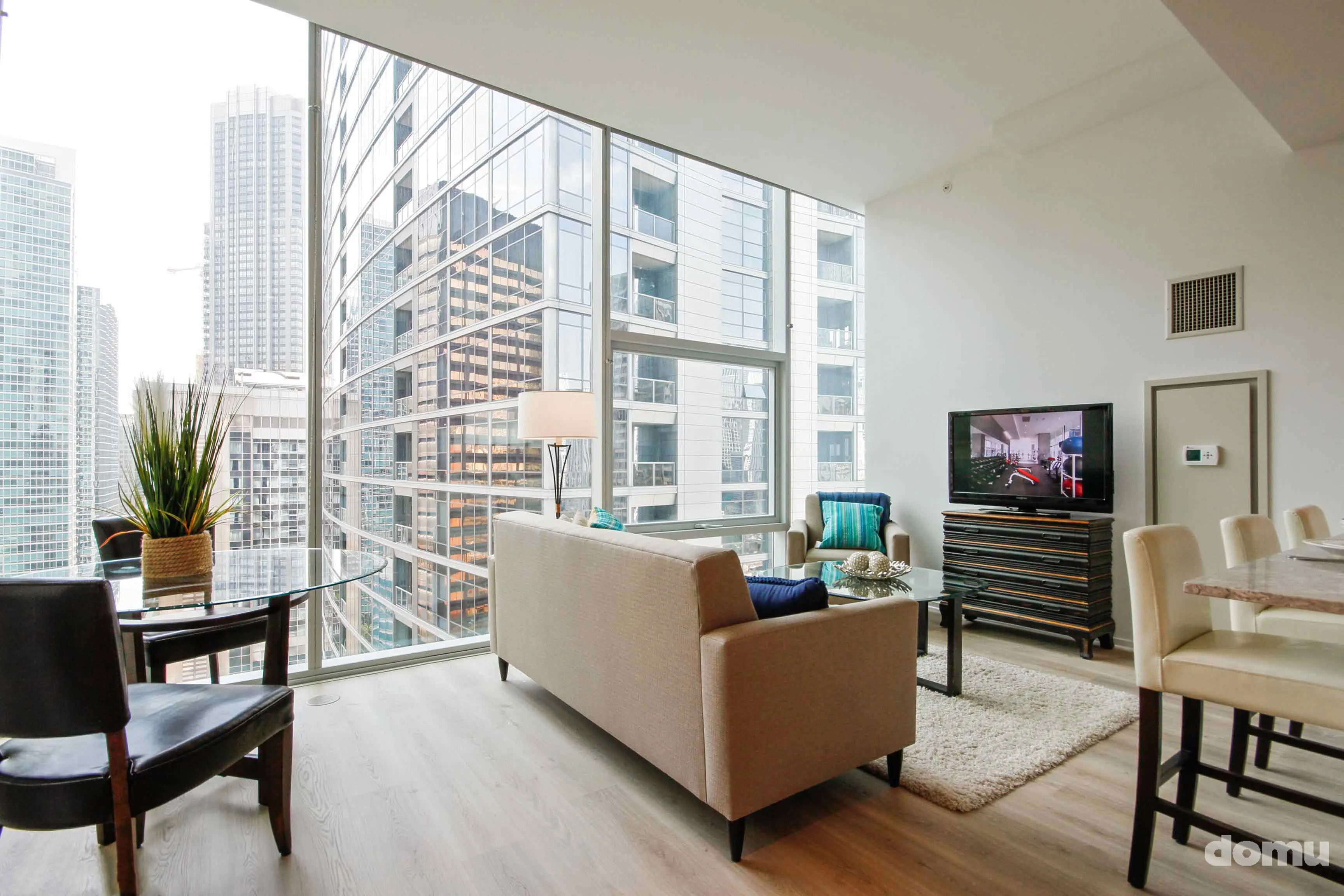 model kitchen with view of Chicago at Optima Signature Apartments