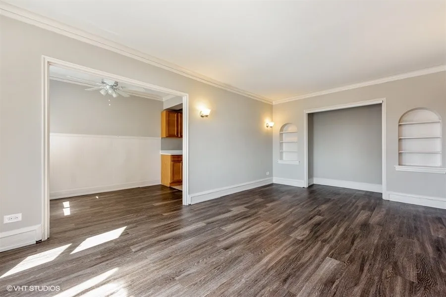 one bedroom living room with wood flooring at 1033 West Loyola Apartments