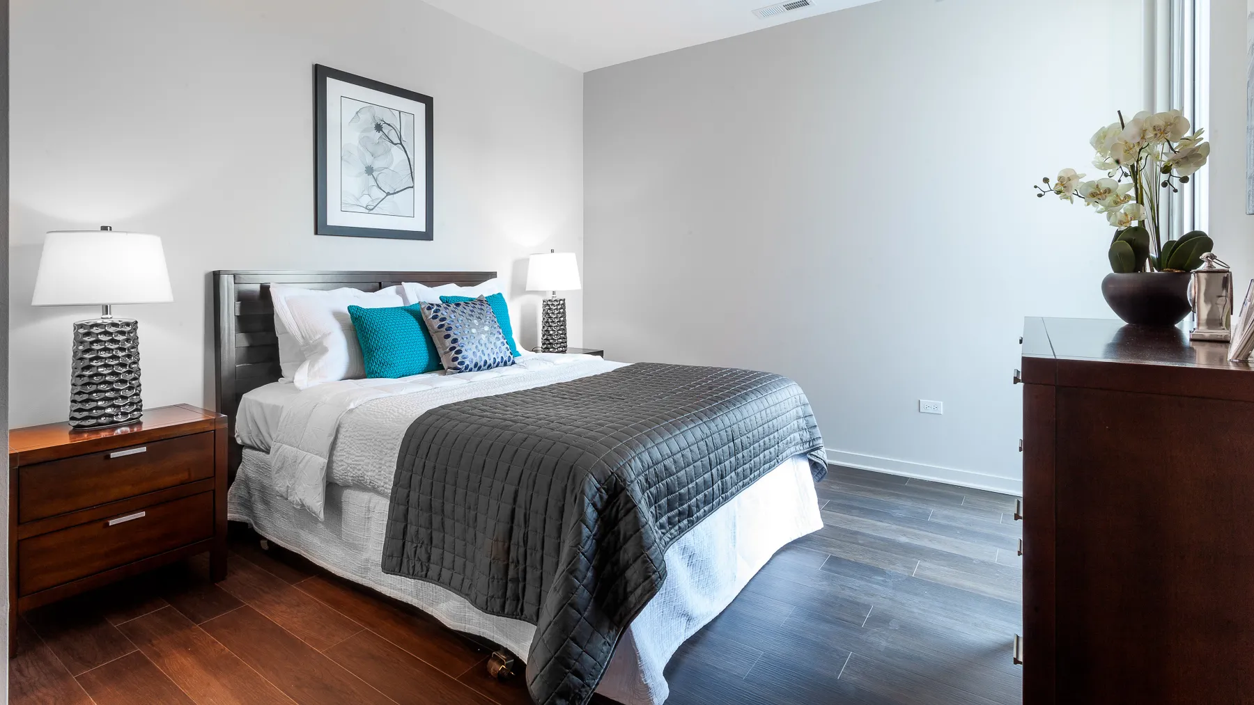 kitchen island with stool and couch at Luxe On Chicago Apartments
