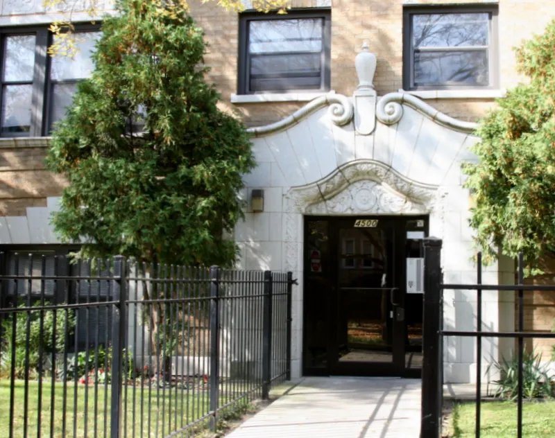 view from street of the brick facade of 4500 North Malden Apartments 