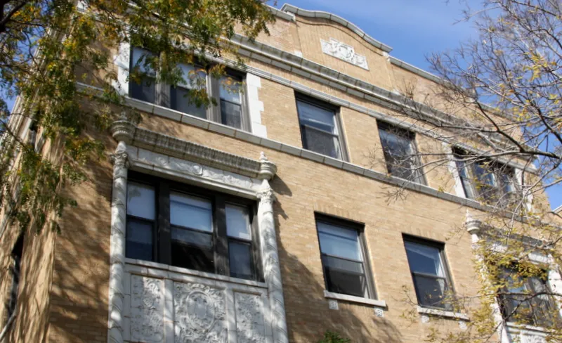 view from street of the brick facade of 4500 North Malden Apartments 