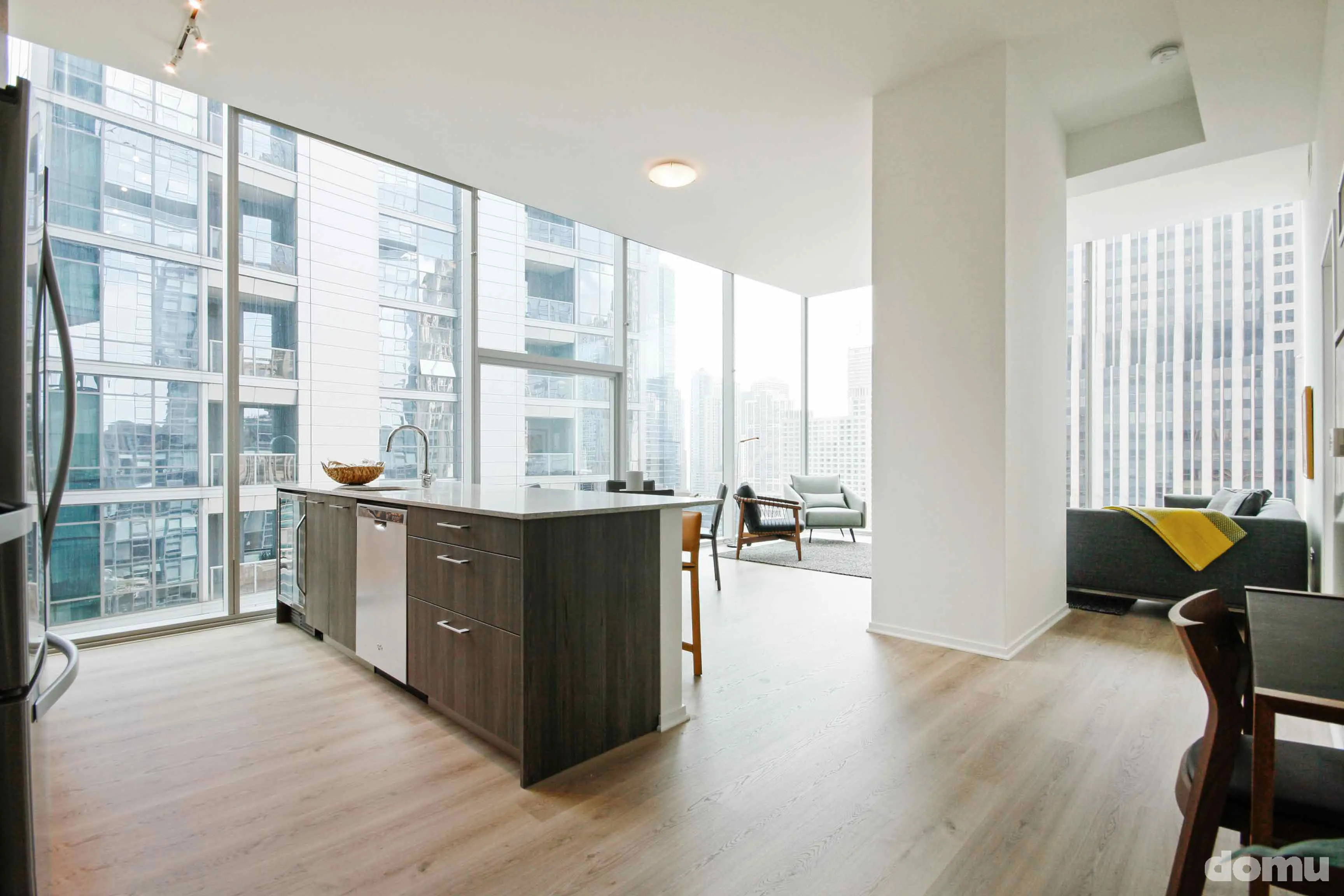 model kitchen with view of Chicago at Optima Signature Apartments