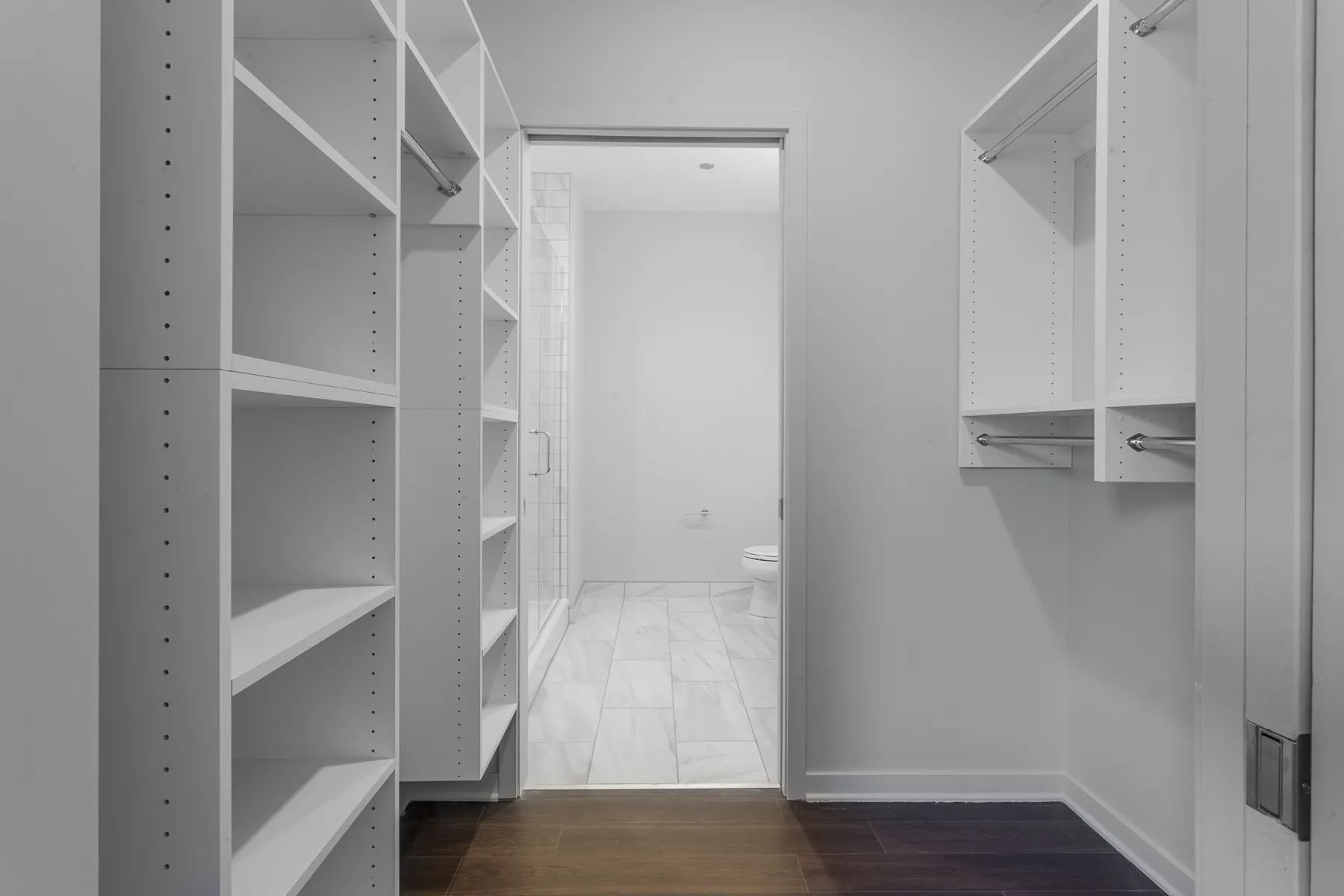 kitchen island with stool and couch at Luxe On Chicago Apartments