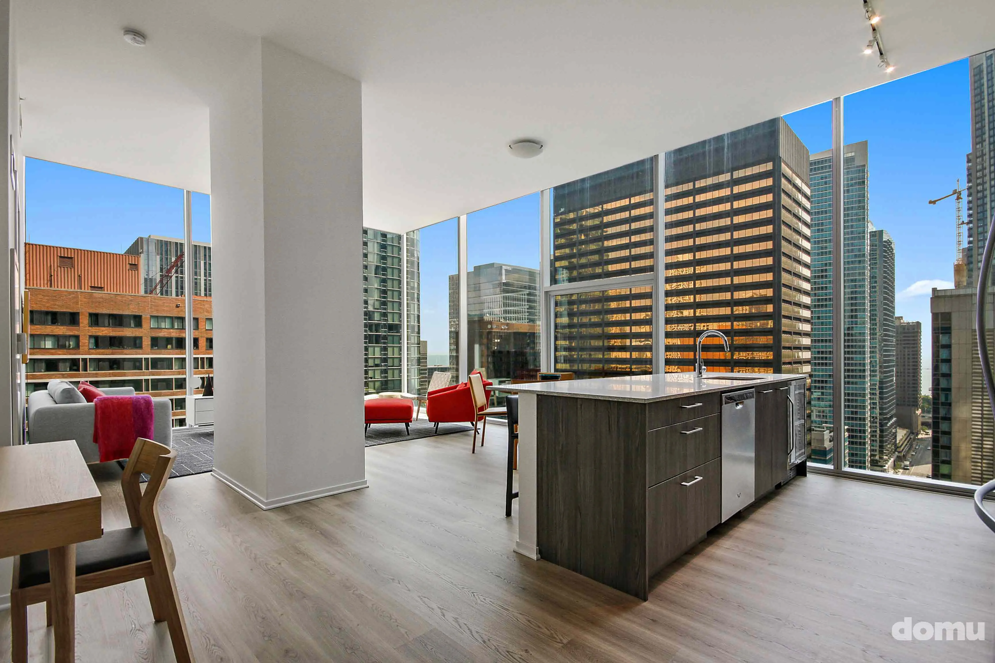 model kitchen with view of Chicago at Optima Signature Apartments