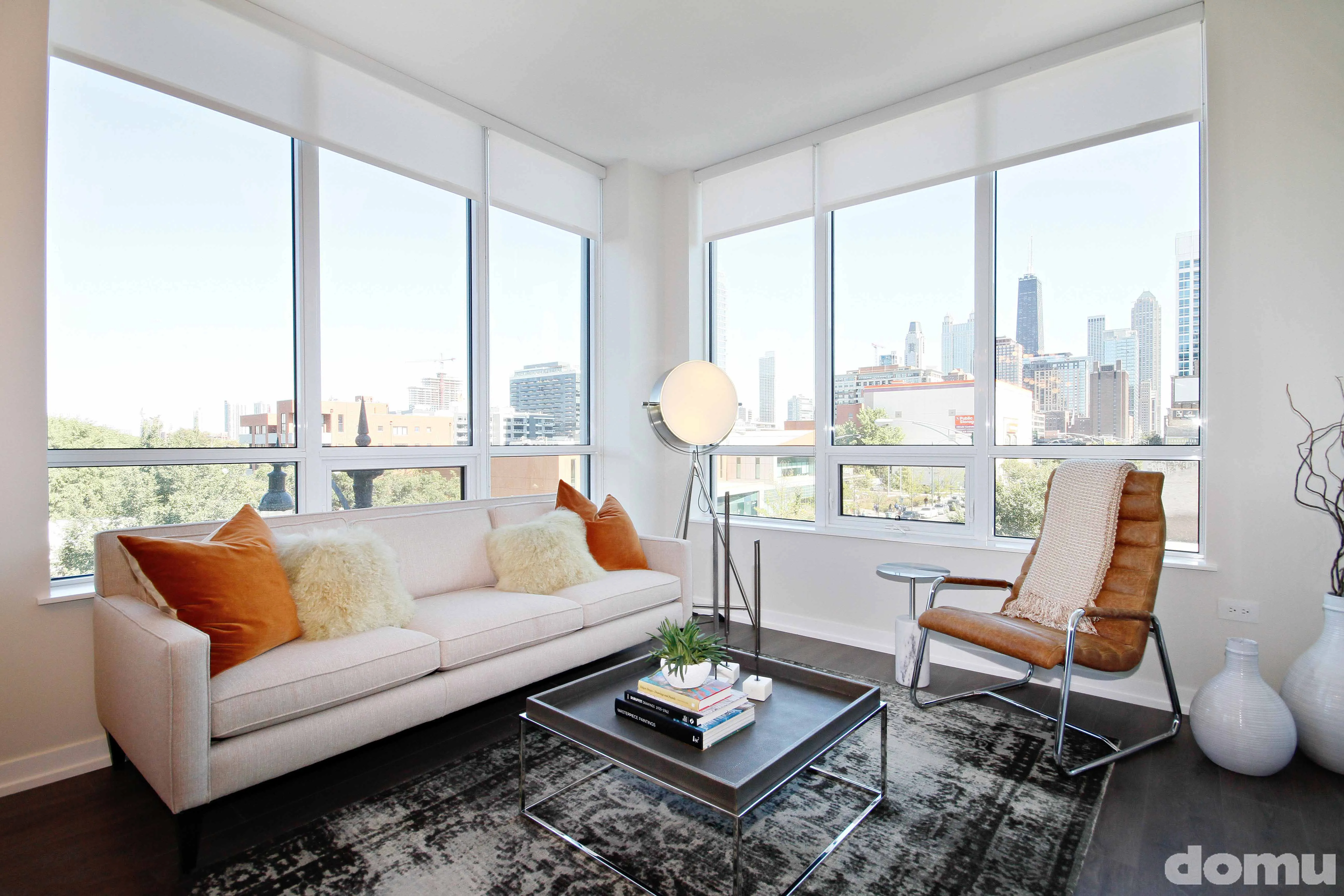 living room with view of chicago skyline at The Hudson Apartments
