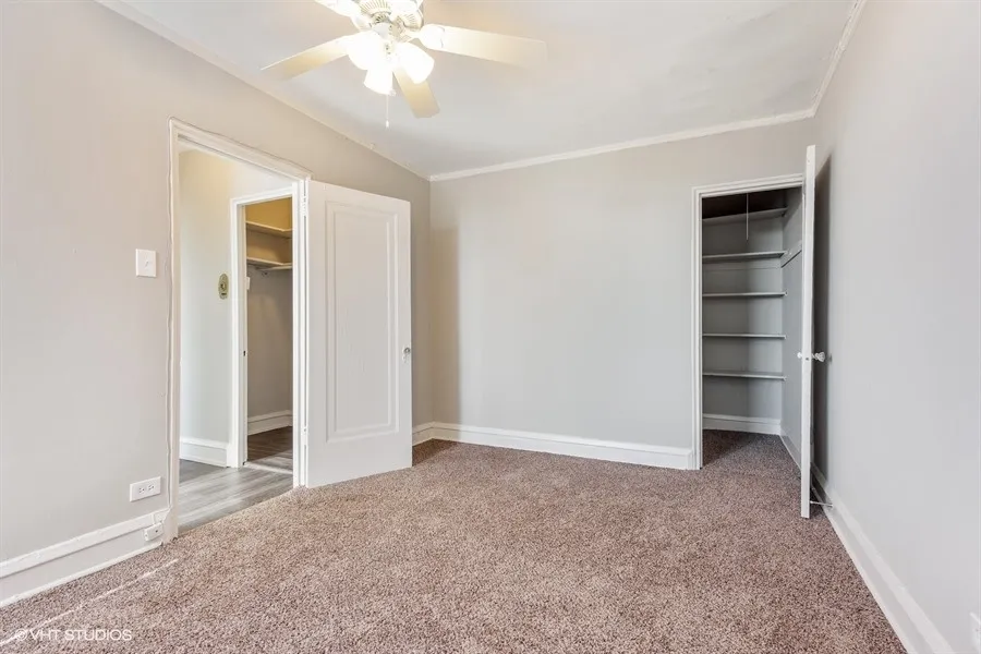 one bedroom living room with wood flooring at 1033 West Loyola Apartments