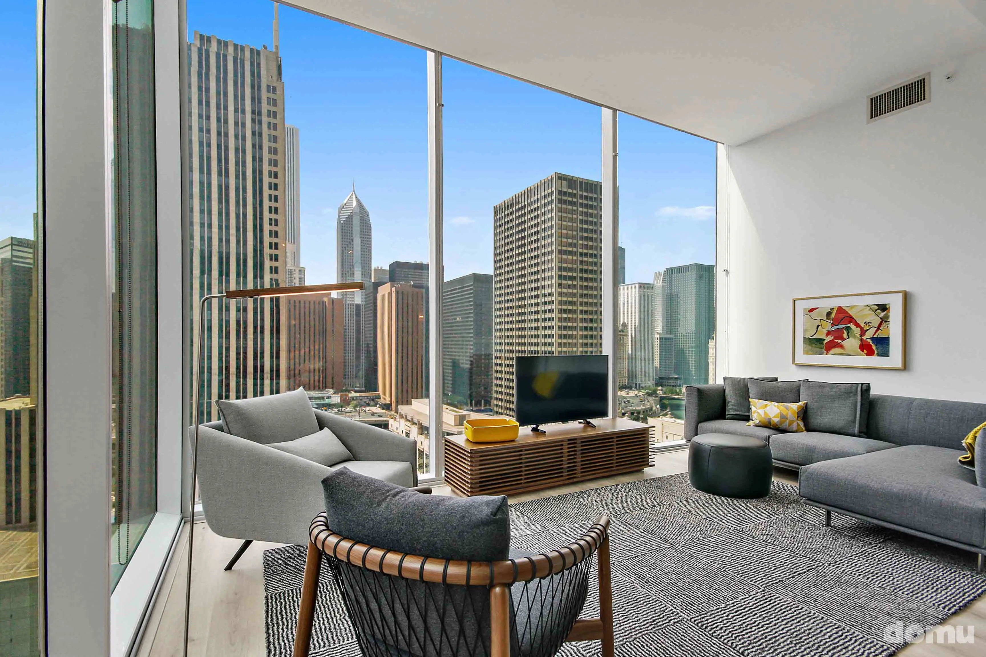 model kitchen with view of Chicago at Optima Signature Apartments