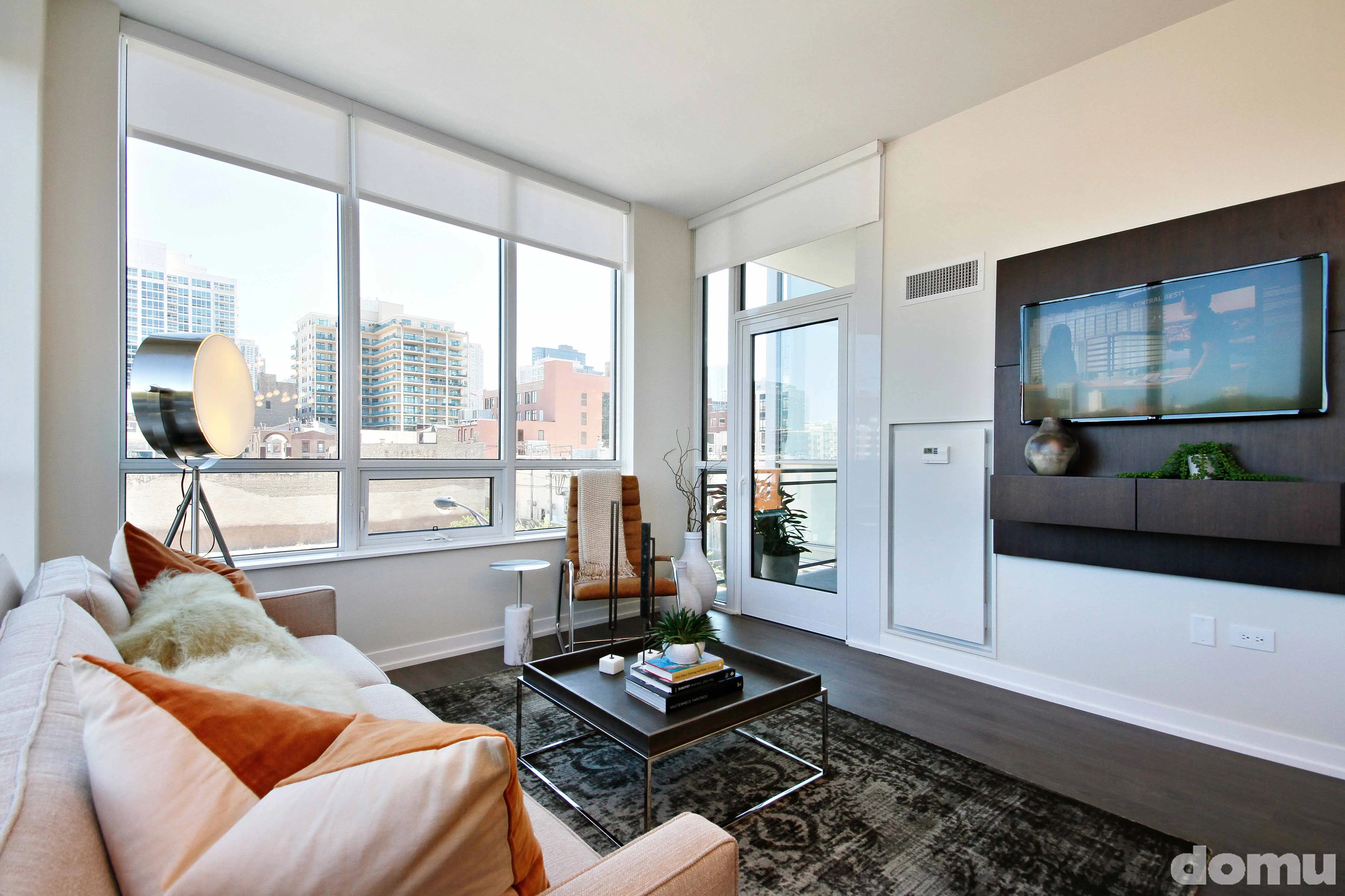 living room and view of downtown chicago at The Hudson Apartments