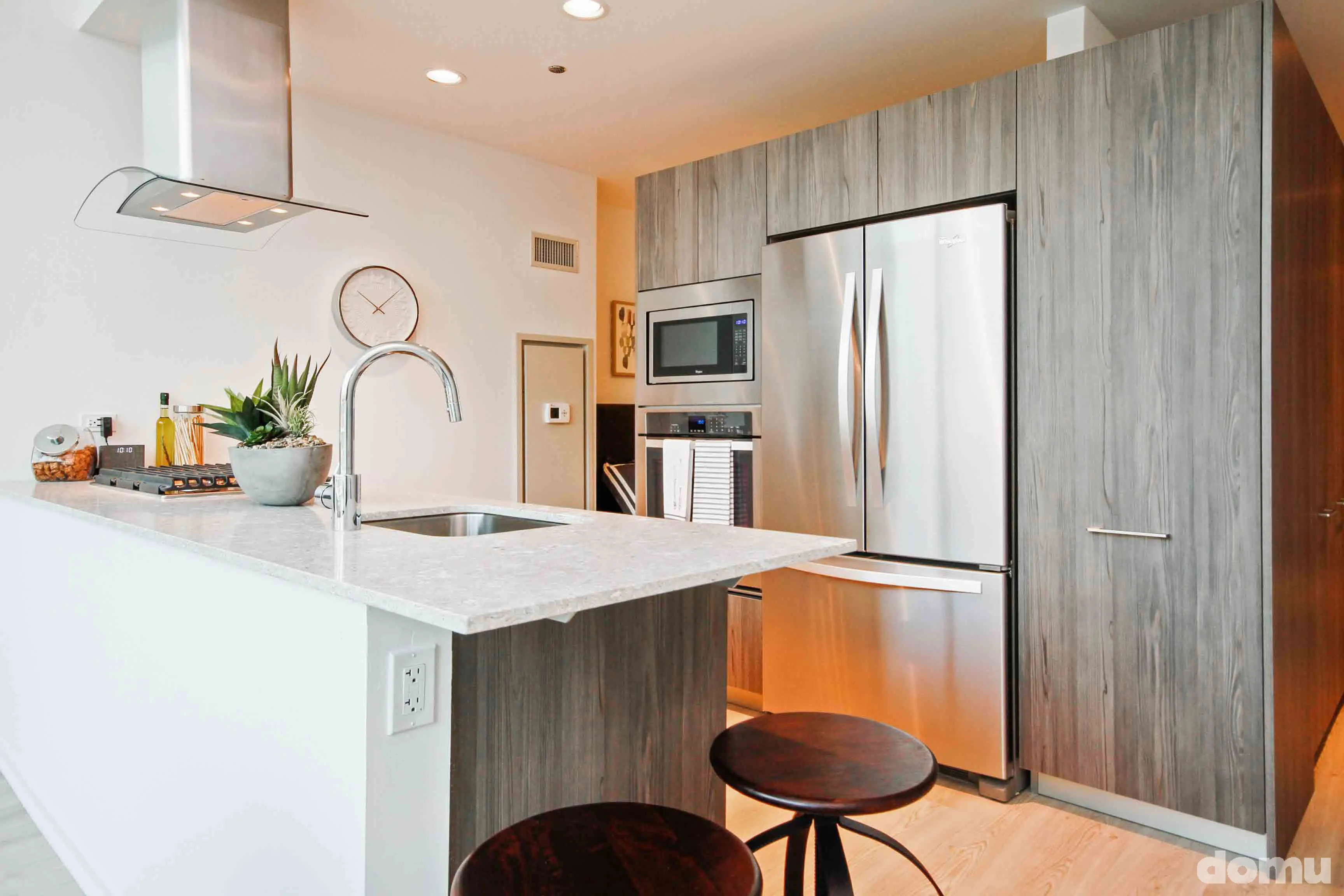 model kitchen with view of Chicago at Optima Signature Apartments