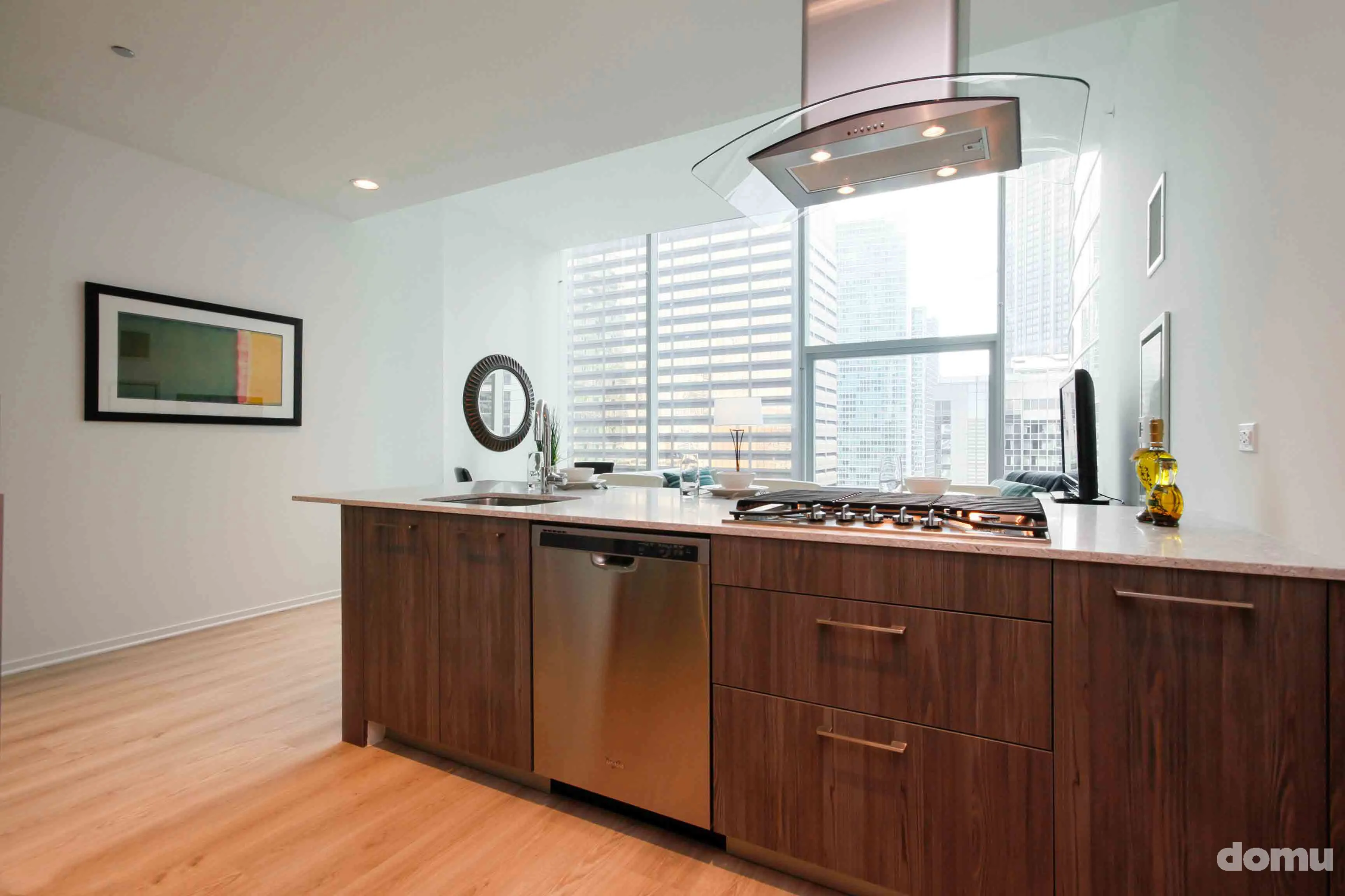 model kitchen with view of Chicago at Optima Signature Apartments