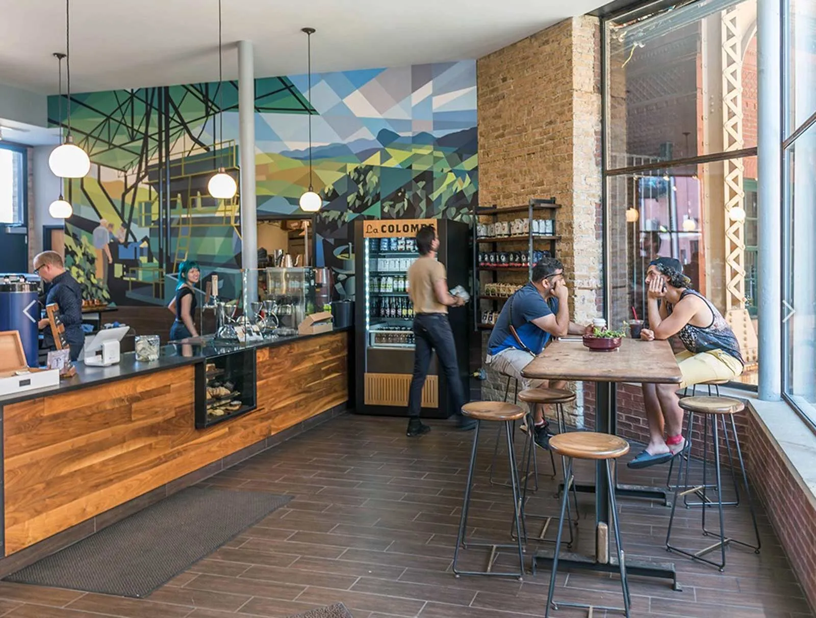 giant loft living room with wood floors at 1550 North Damen Lofts
