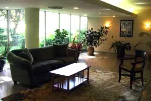 exterior view of trees and the two towers of 5630 North Sheridan Apartments