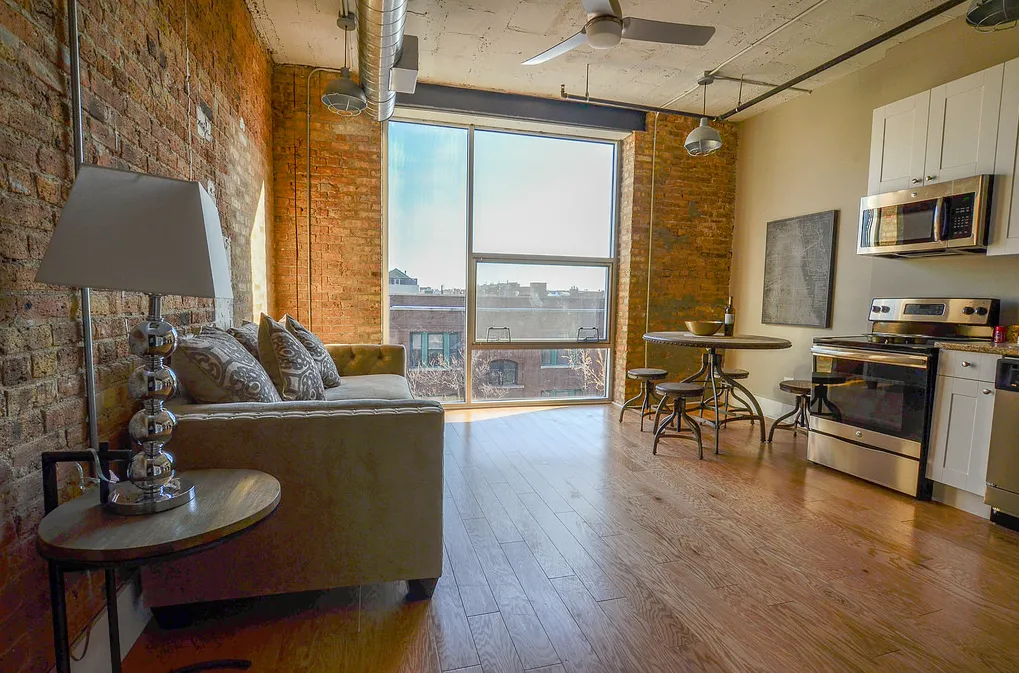 exposed brick in living room of 3141 North Sheffield Apartments in Lakeview