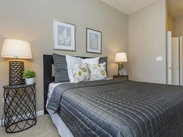 modern kitchen with brown wood cabints at The Shelby Apartments in Chicago