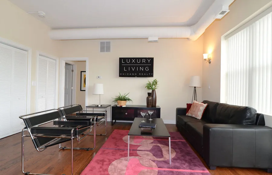 kitchen and island with wood floors at Riverview Terrace Apartments