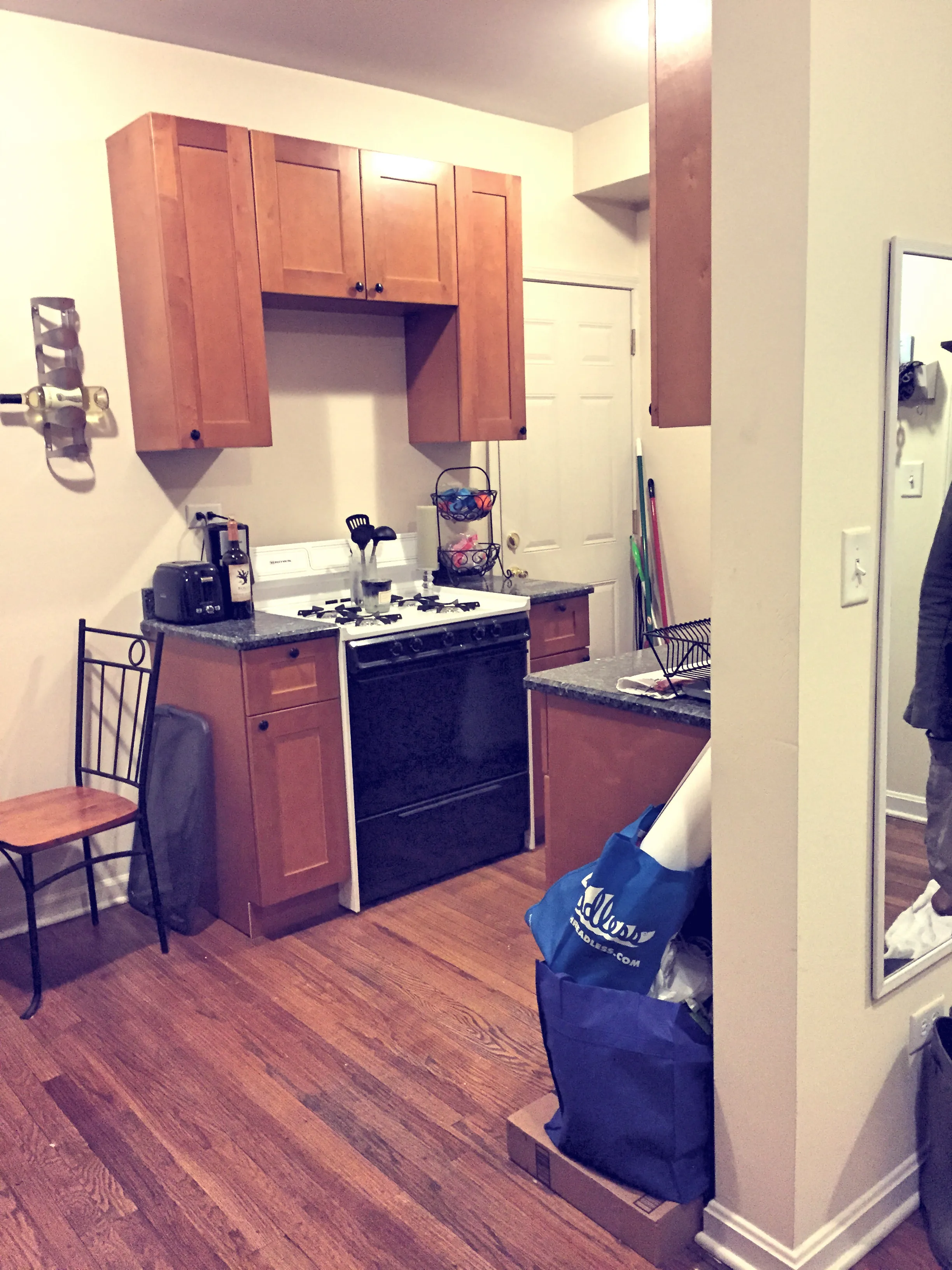 Kitchen separated by entryway wall
