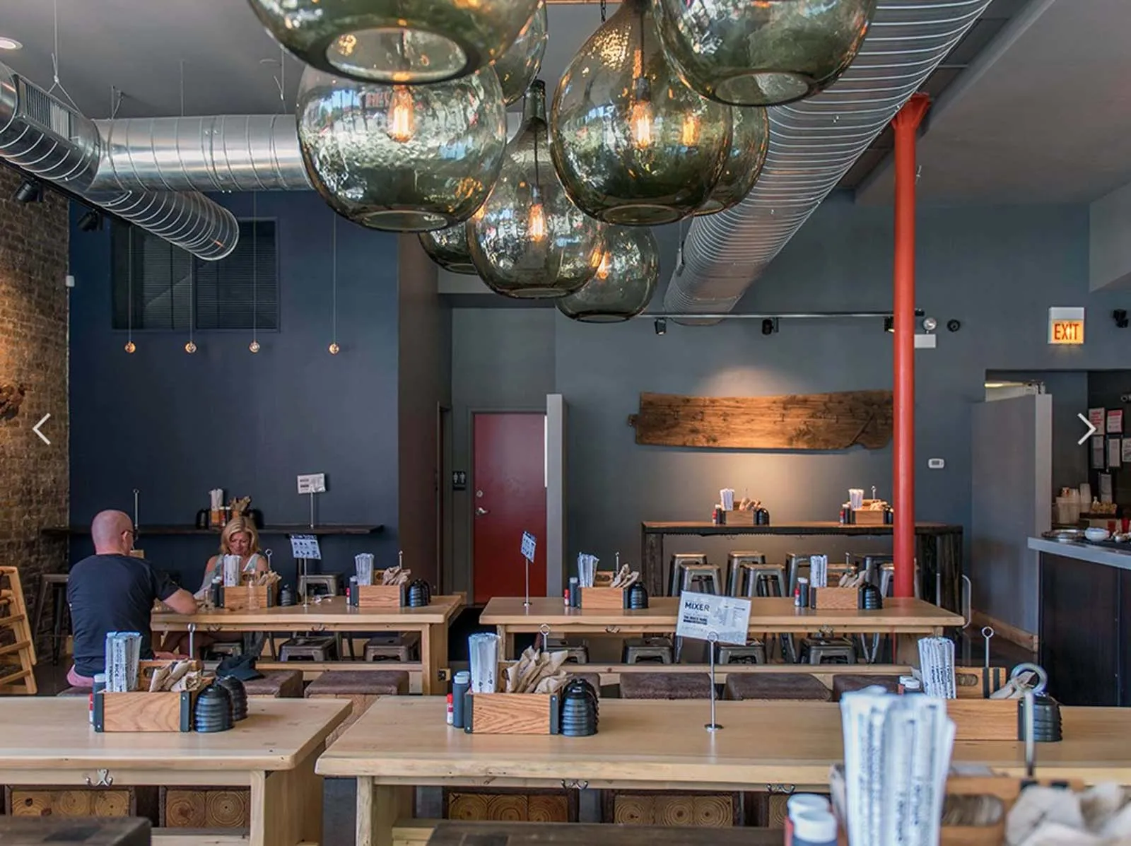 giant loft living room with wood floors at 1550 North Damen Lofts
