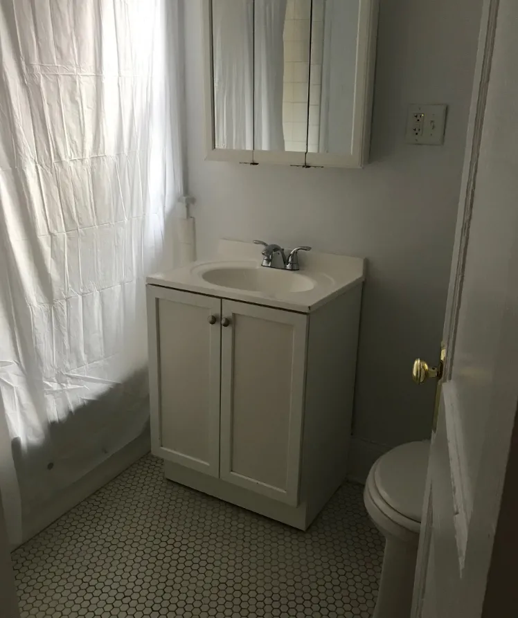 vintage living room with wood floors at 627-41 West Roscoe Apartments