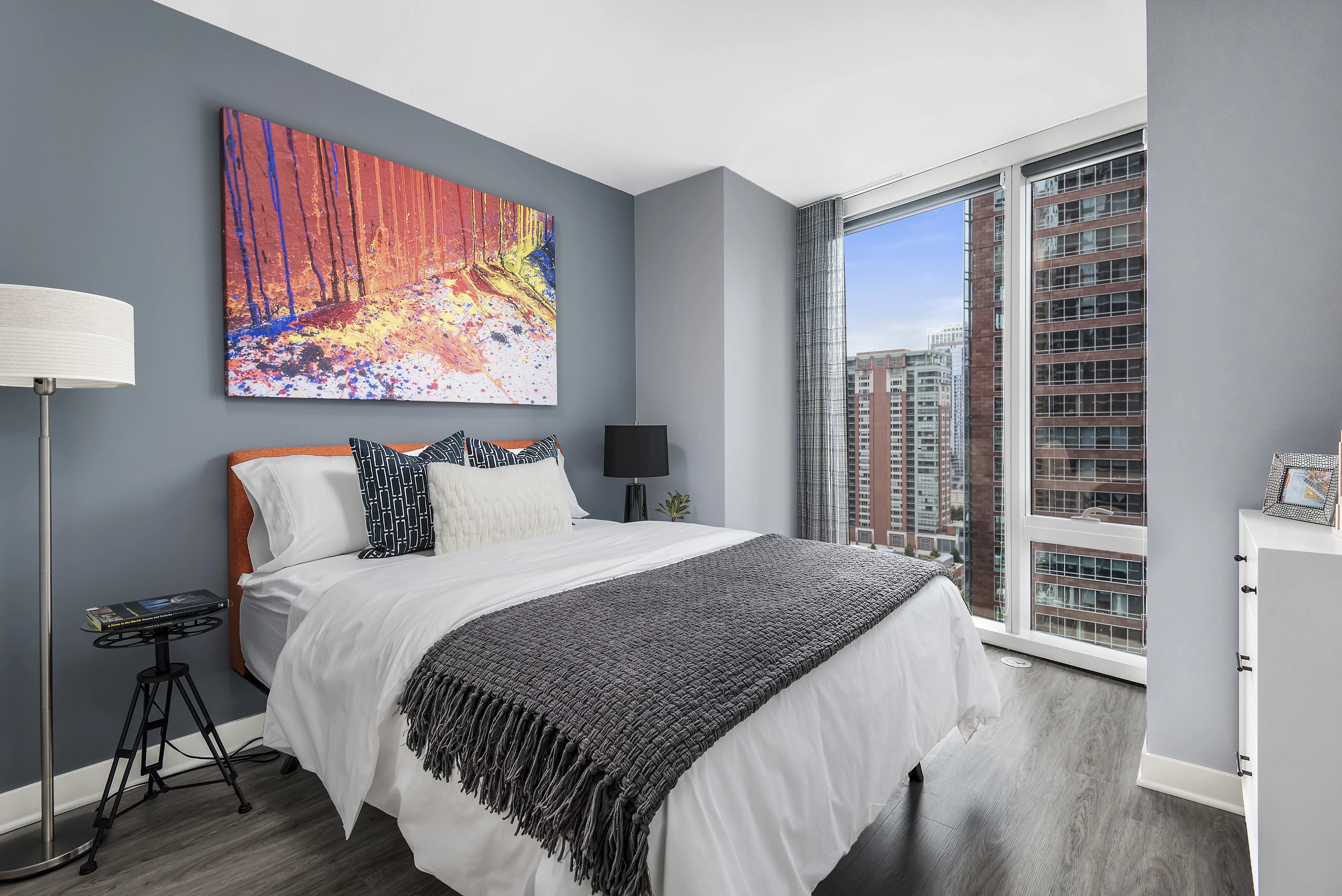 living room with brown couch at Moment Apartments in Streeterville Chicago