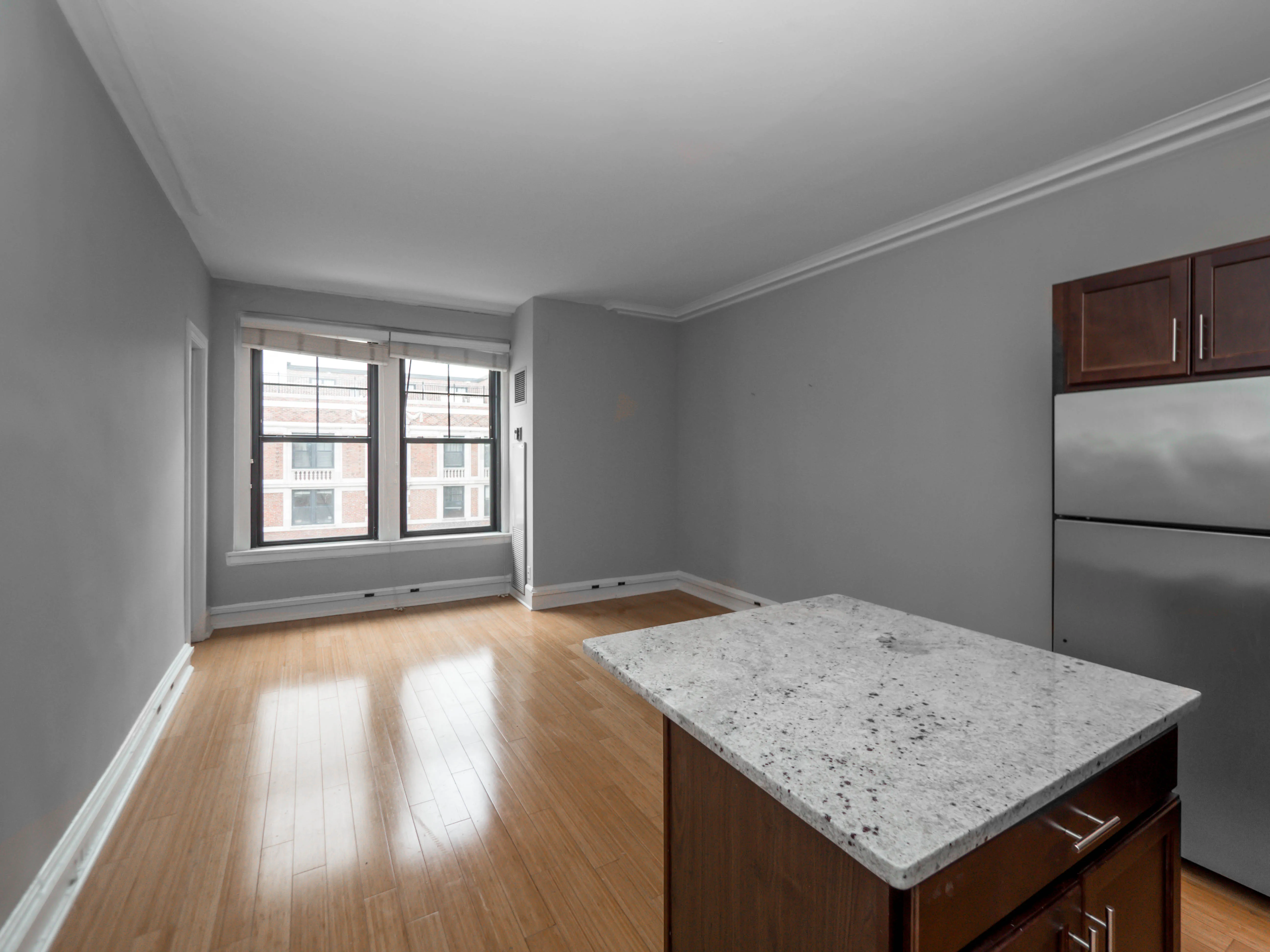 lobby entrance with limestone facade at The Belmont By Reside Apartments