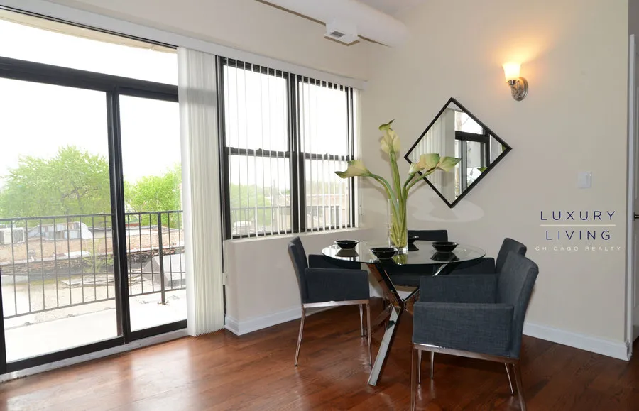 kitchen and island with wood floors at Riverview Terrace Apartments