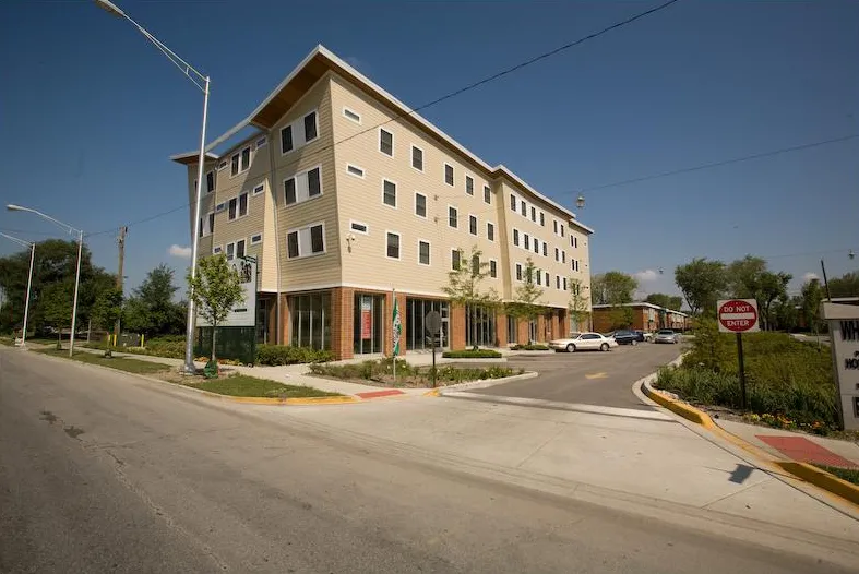summer view of the landscaped front of Whistler Crossing Apartments