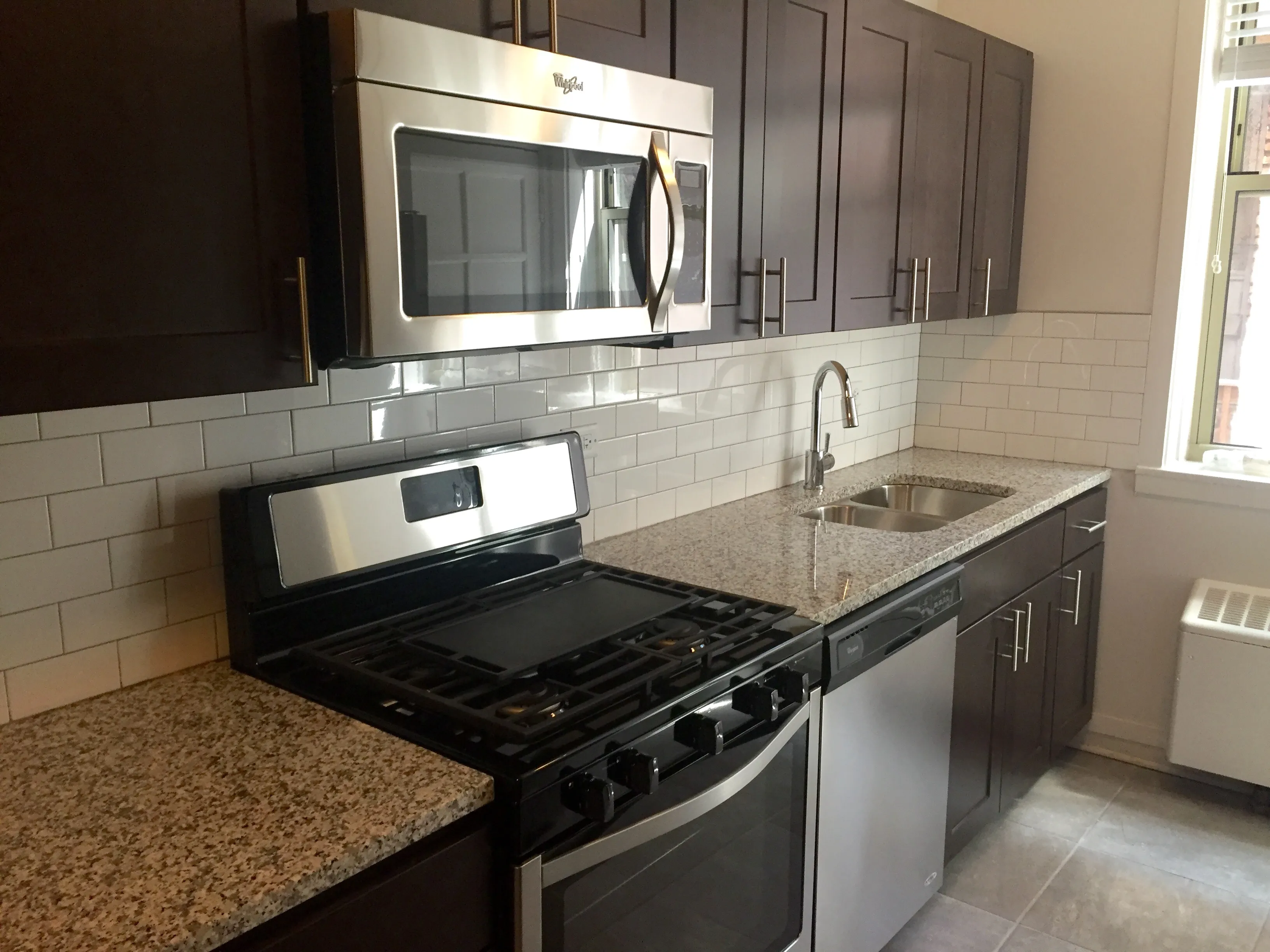 exterior shot with trees of 1310 East Hyde Park Apartments