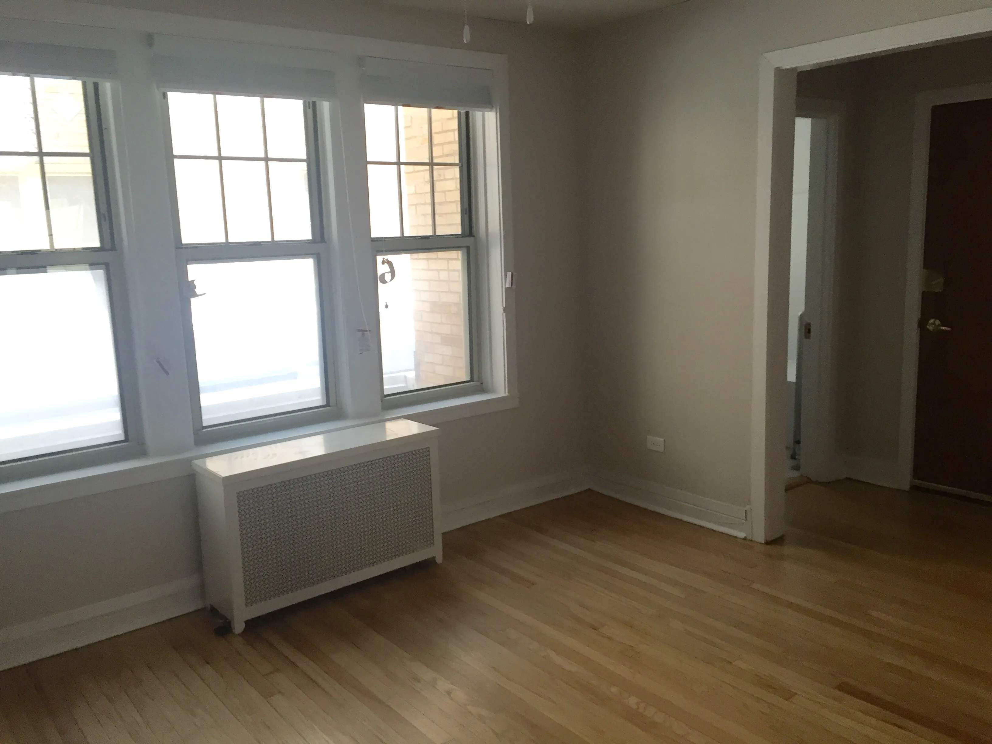 exterior shot with trees of 1310 East Hyde Park Apartments