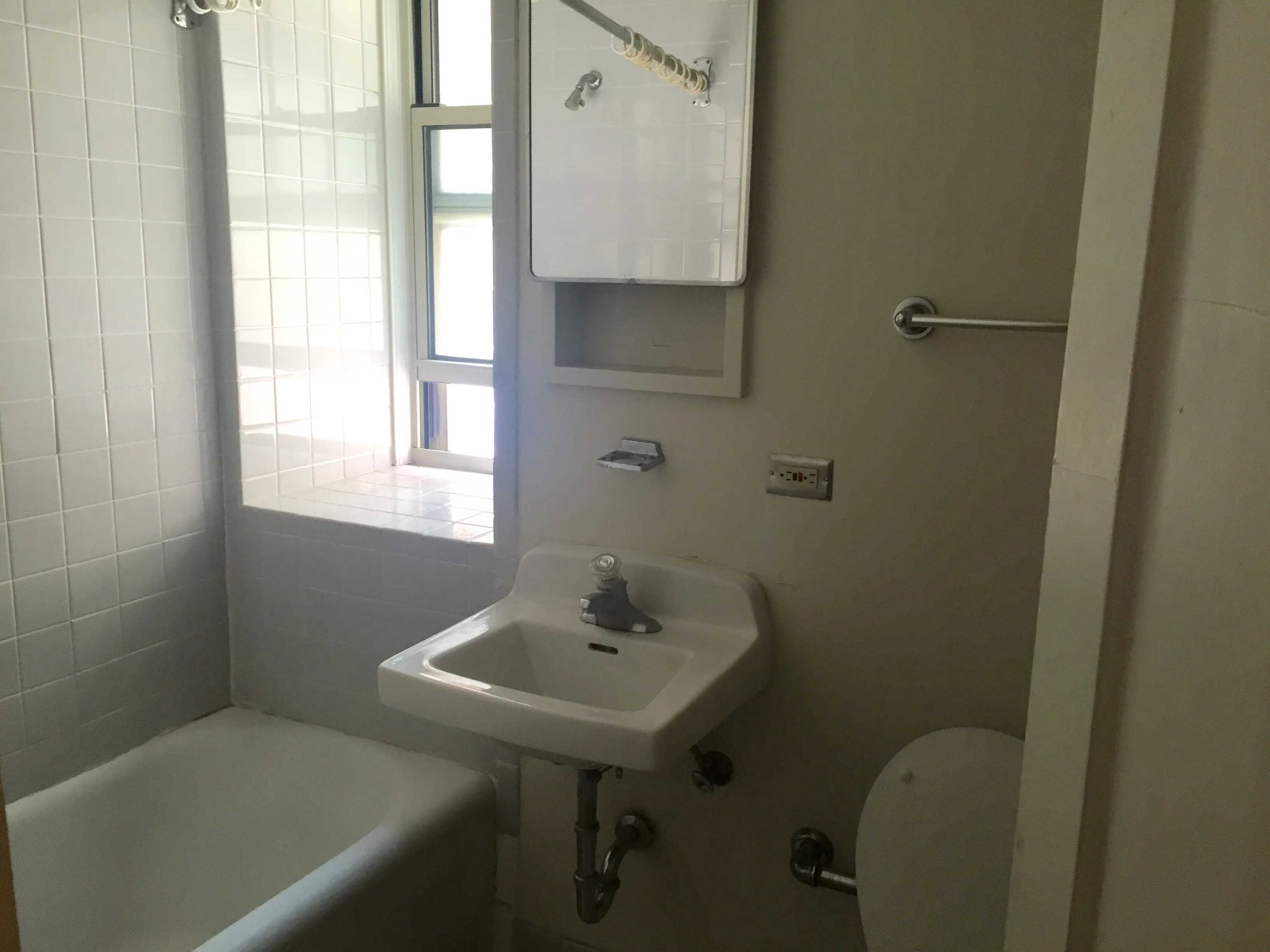 exterior shot with trees of 1310 East Hyde Park Apartments