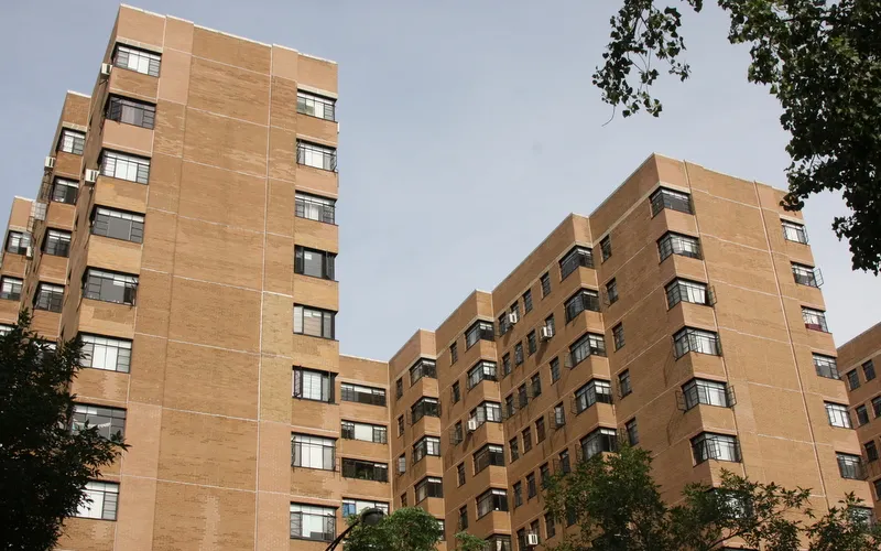 exterior view of trees and the two towers of 5630 North Sheridan Apartments