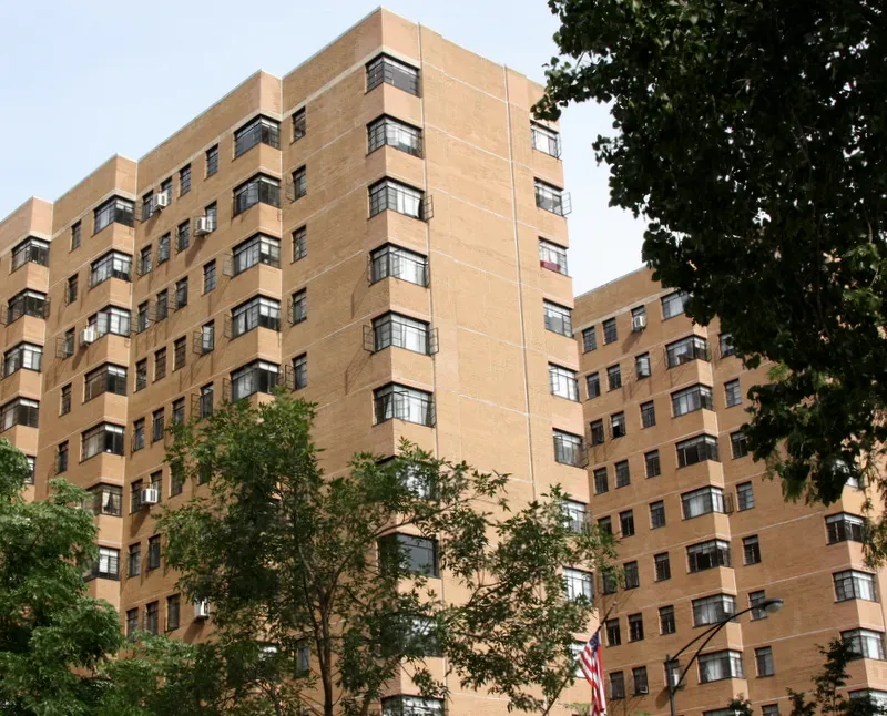 exterior view of trees and the two towers of 5630 North Sheridan Apartments