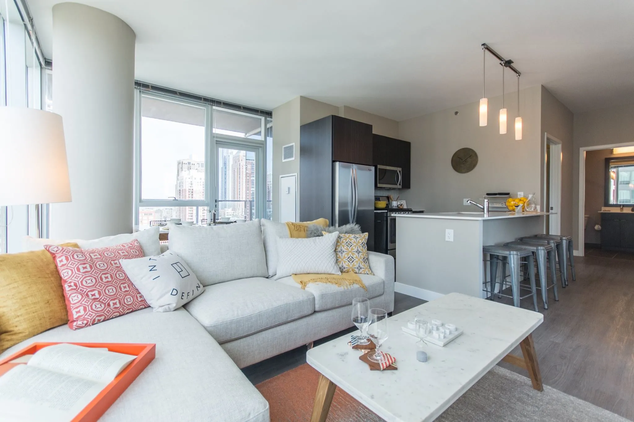 living room and skyline view at 1000 South Clark Apartments