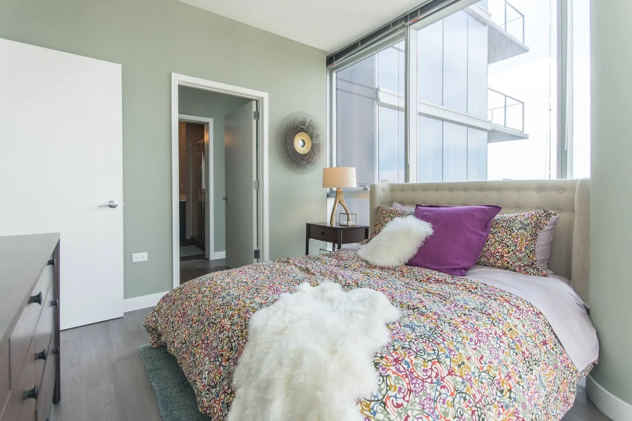 living room and skyline view at 1000 South Clark Apartments